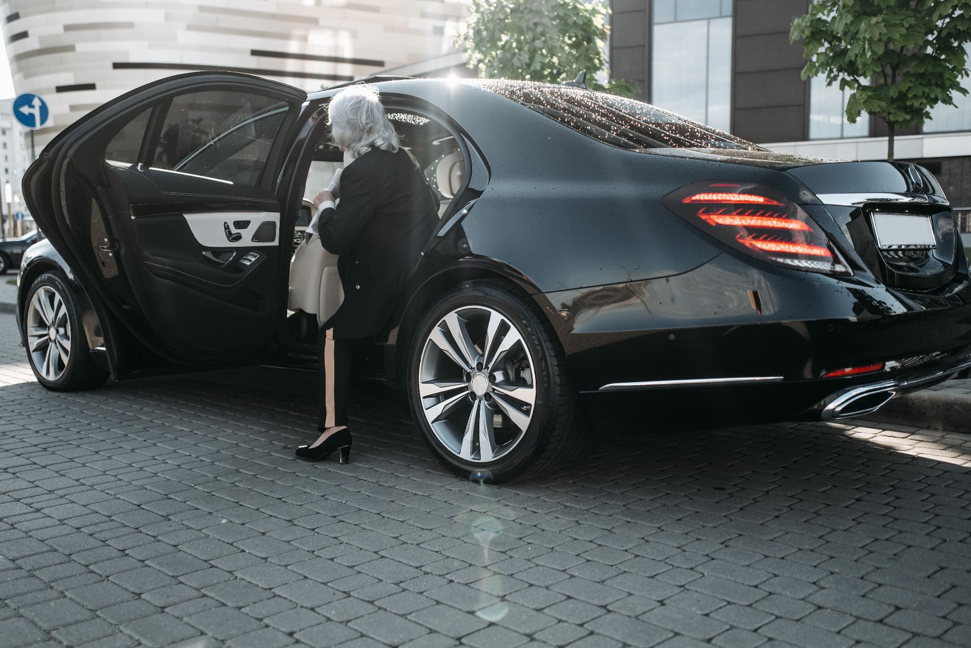 Professional chauffeur service with a black luxury sedan in Stuttgart